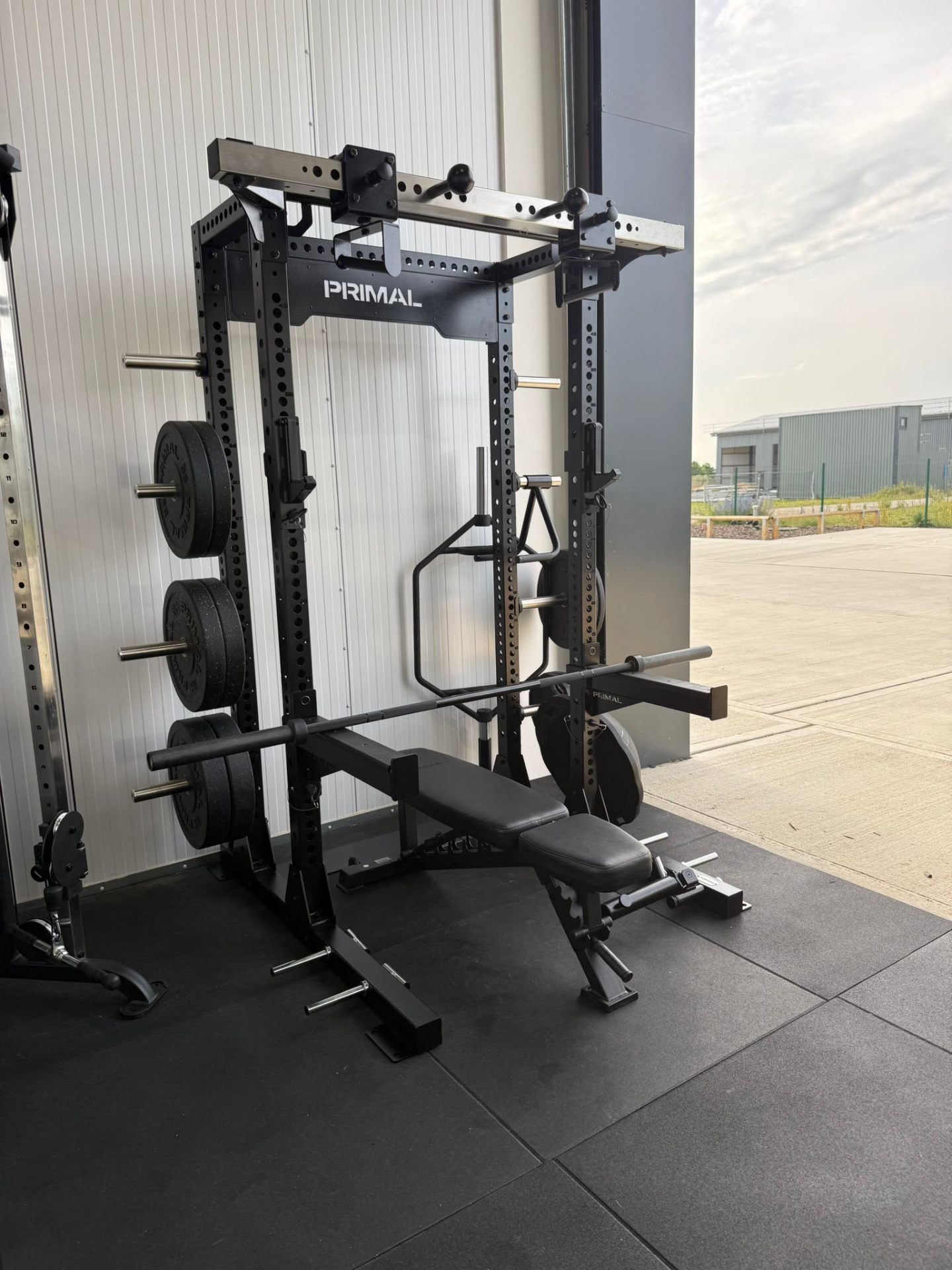 Private gym at Relentless Health & Fitness with the big roller door open letting in sunlight